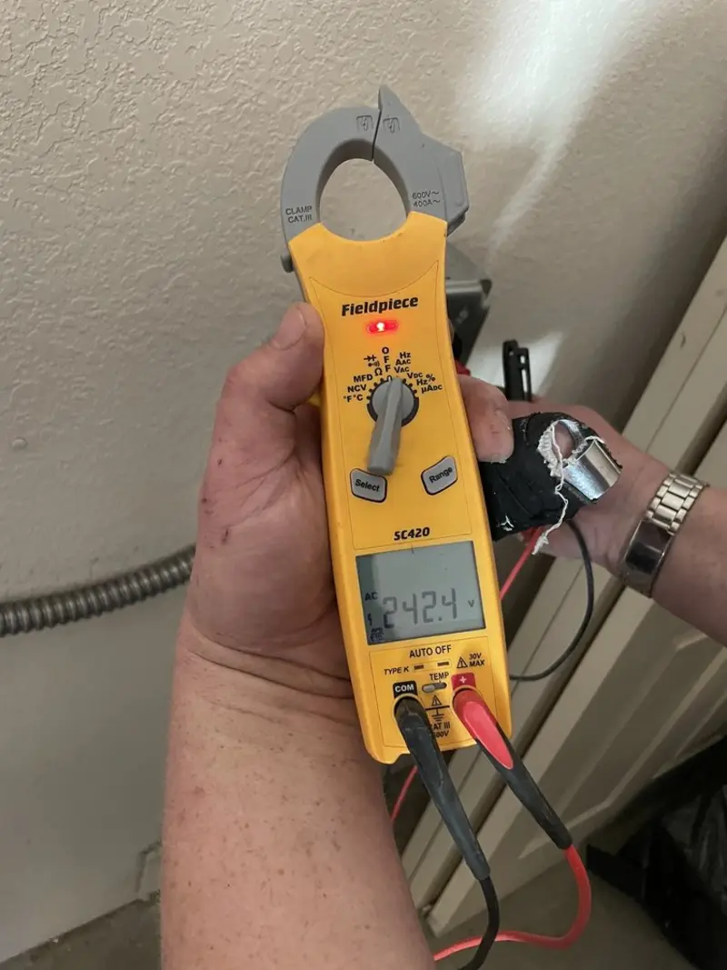 Voltage testing with clamp meter during Generator Installation in Franklin Park